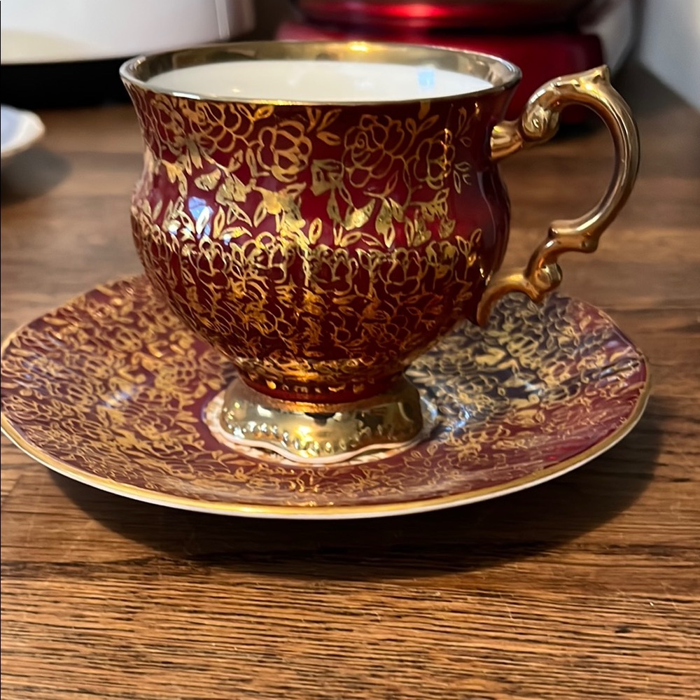 Elegant Red and Gold Floral Teacup and Saucer
